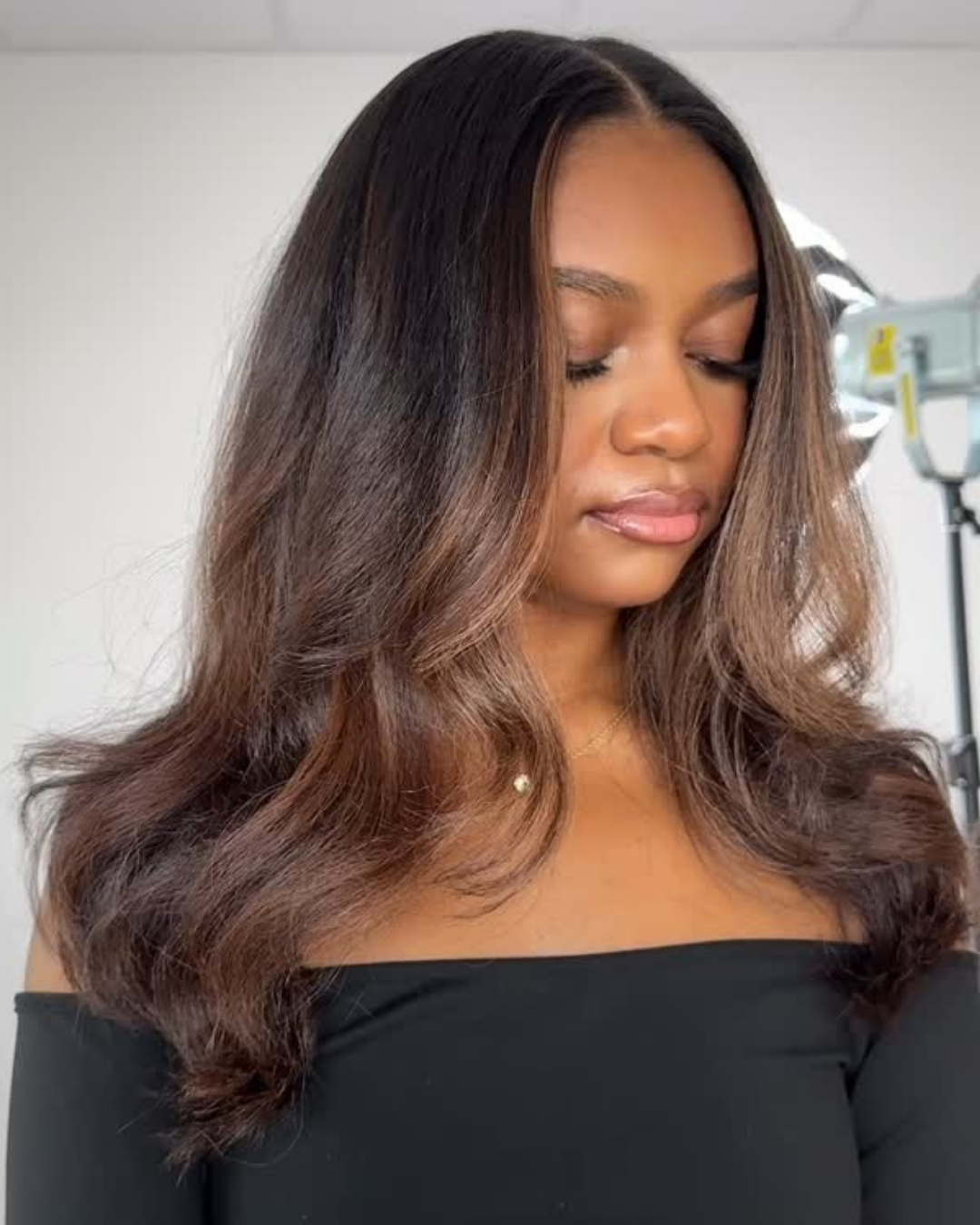 Dimensional warm brown balayage on a silk press