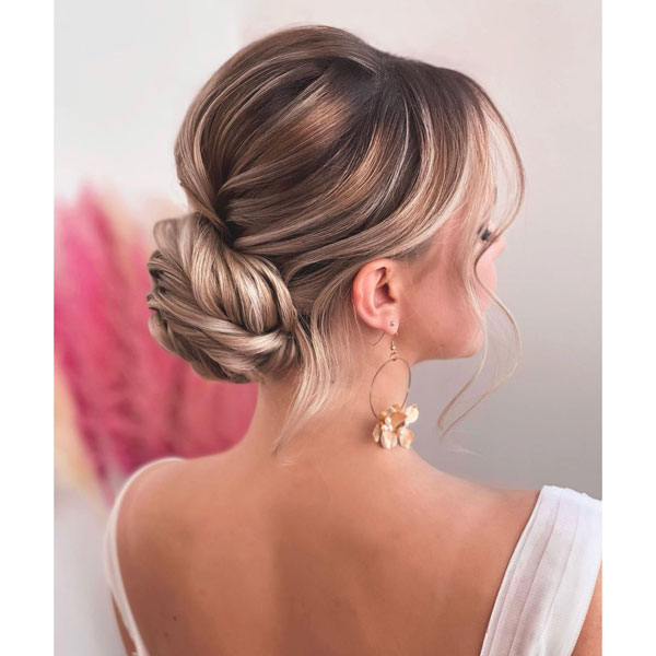 Soft low bridal bun style