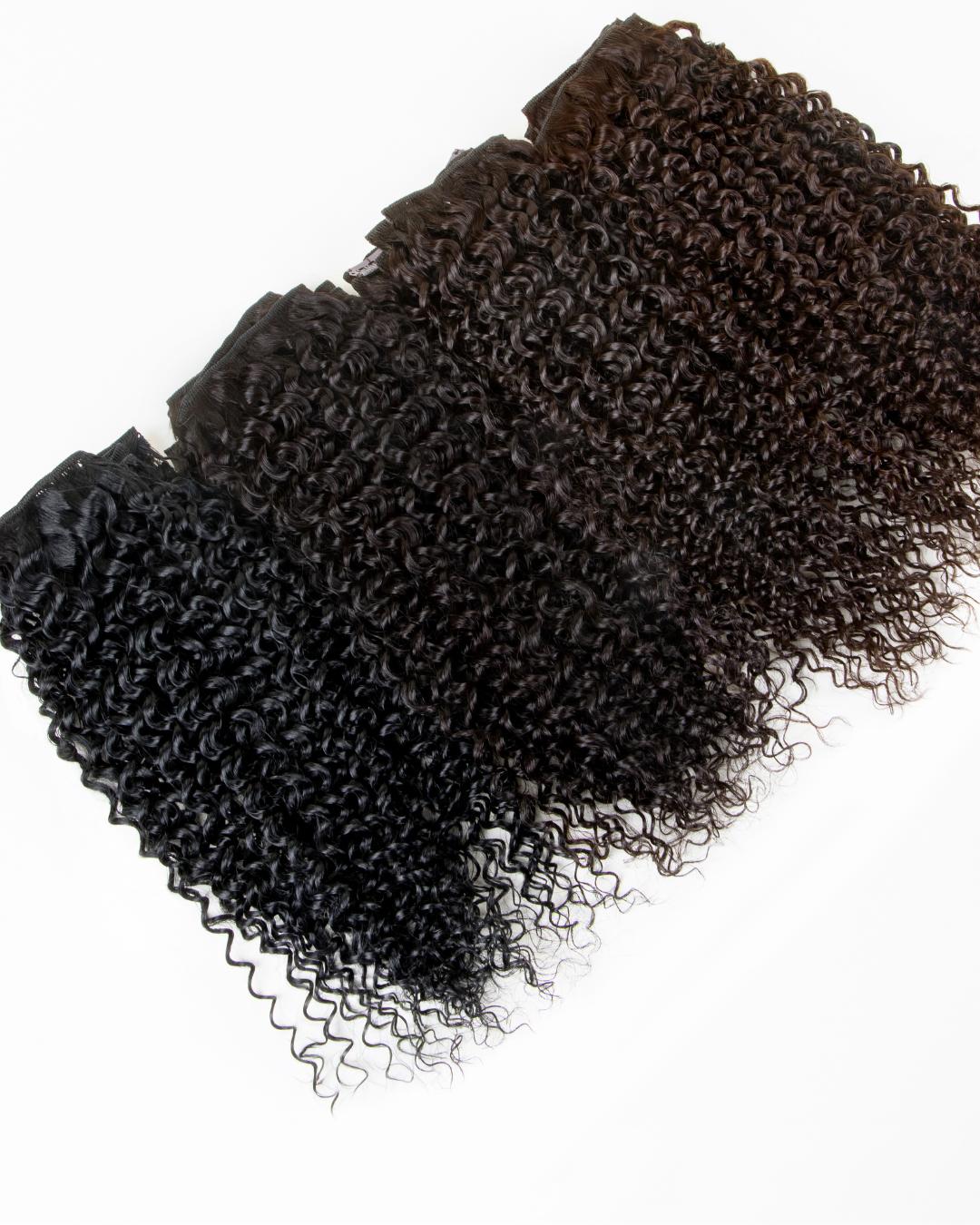Deep Spiral curly hair extensions shown in four shades from black to medium brown