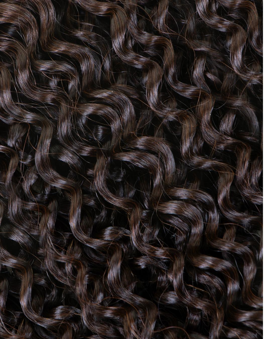 Close-up of Deep Spiral curl pattern designed for textured hair clients