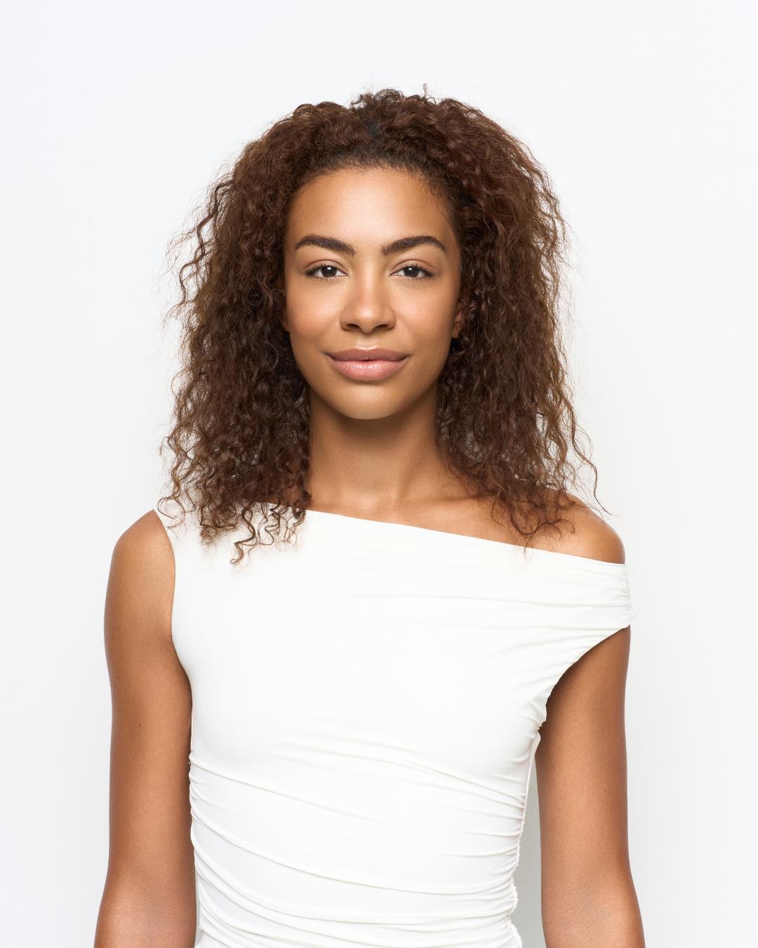 Before image showing natural textured hair prior to extension application