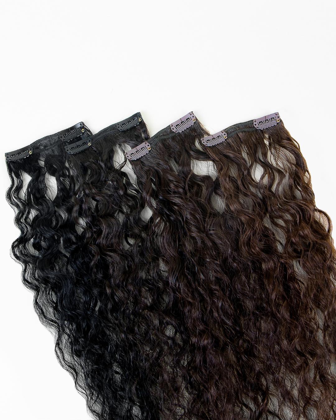 Loose Spiral curly extensions displayed in multiple shades for texture matching