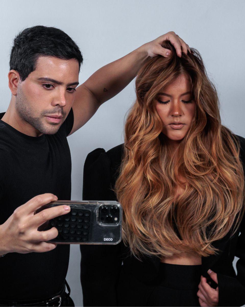 Danilo Herbert styles a model with long dimensional blonde hair during his Free Hands Blond presentation at TRUSS Connection Global.
