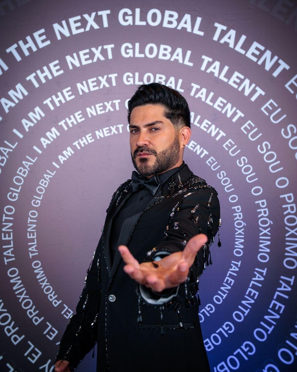 Jhoan Acevedo, International Event Specialist for TRUSS Professional, poses in front of a branded "The Next Global Talent" backdrop during TRUSS Connection Global in Lima, Peru.