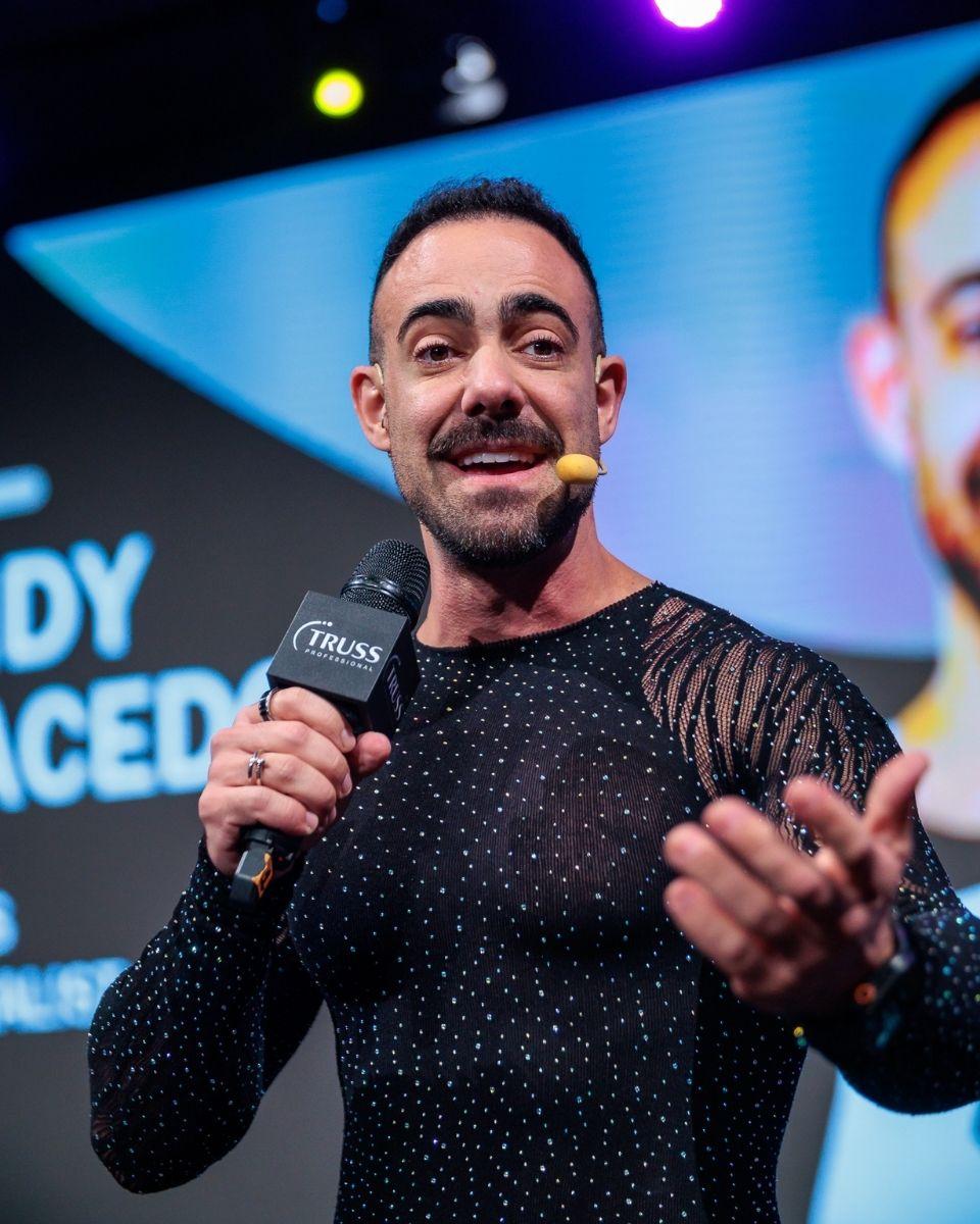 TRUSS Brand Specialist Andy Macedo speaks onstage during a live event presentation.