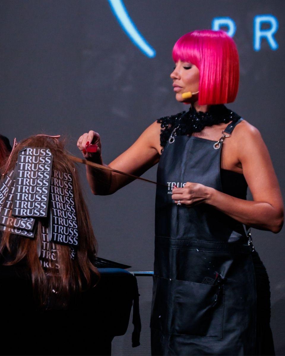 Lisa Hernandez demonstrates color techniques onstage during a TRUSS Professional education class.