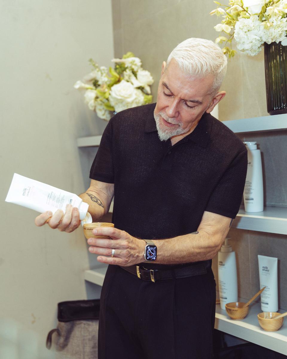 John Maroney pours milk_shake Everlasting Bonds product into a bowl during the brand’s press launch event at Rob Peters Salon.