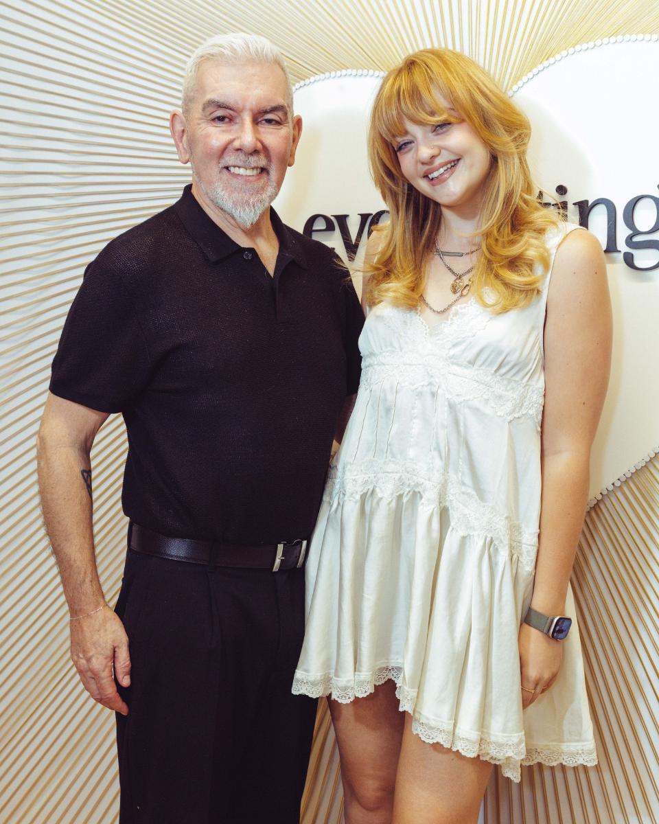 John Maroney and Lauren Freas pose together in front of the Everlasting Bonds event backdrop.