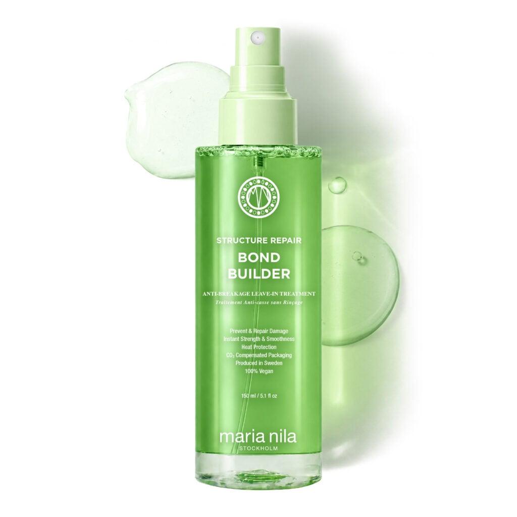 Alt text: Maria Nila Structure Repair Bond Builder anti-breakage leave-in treatment bottle on a white background with translucent green product texture.