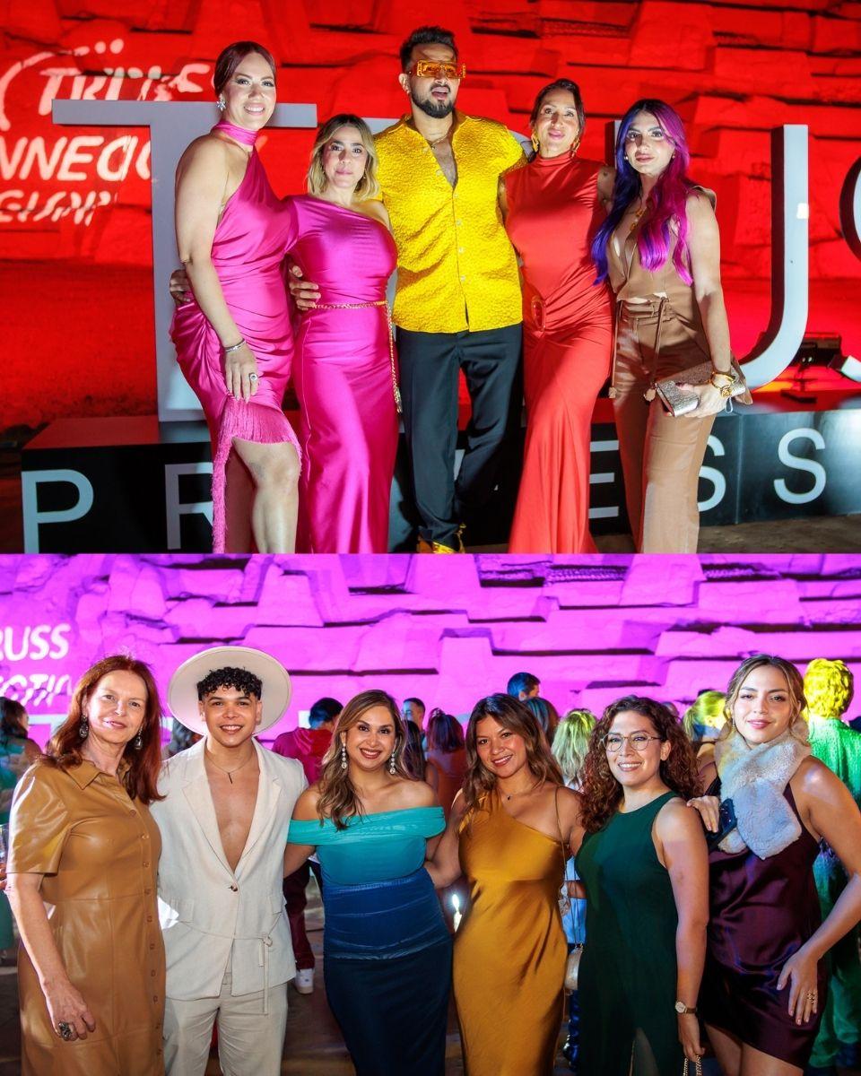 Groups of guests pose together in colorful outfits during an evening party at a historical site in Peru.