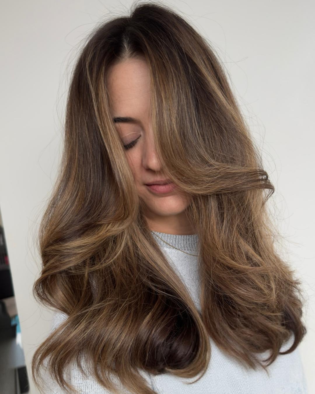 after soft blowout with honey brunette Photo Credit Instagram via @hairbylisamathews