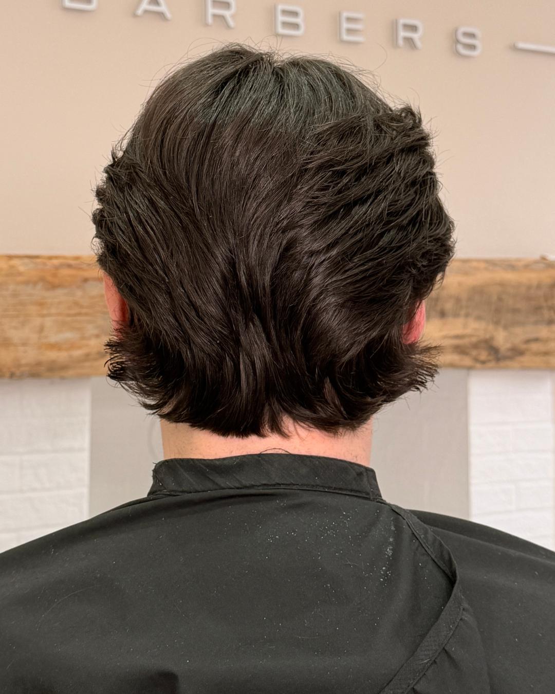 back of longer flow cut Photo courtesy of Morgan Jones (@morganjonesbarbers)
