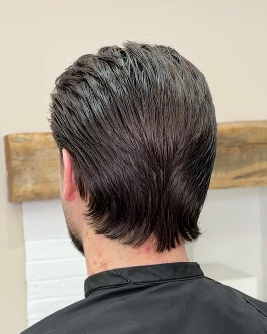 back view of flow cut with texture and movement and light shine Photo courtesy of Morgan Jones (@morganjonesbarbers)