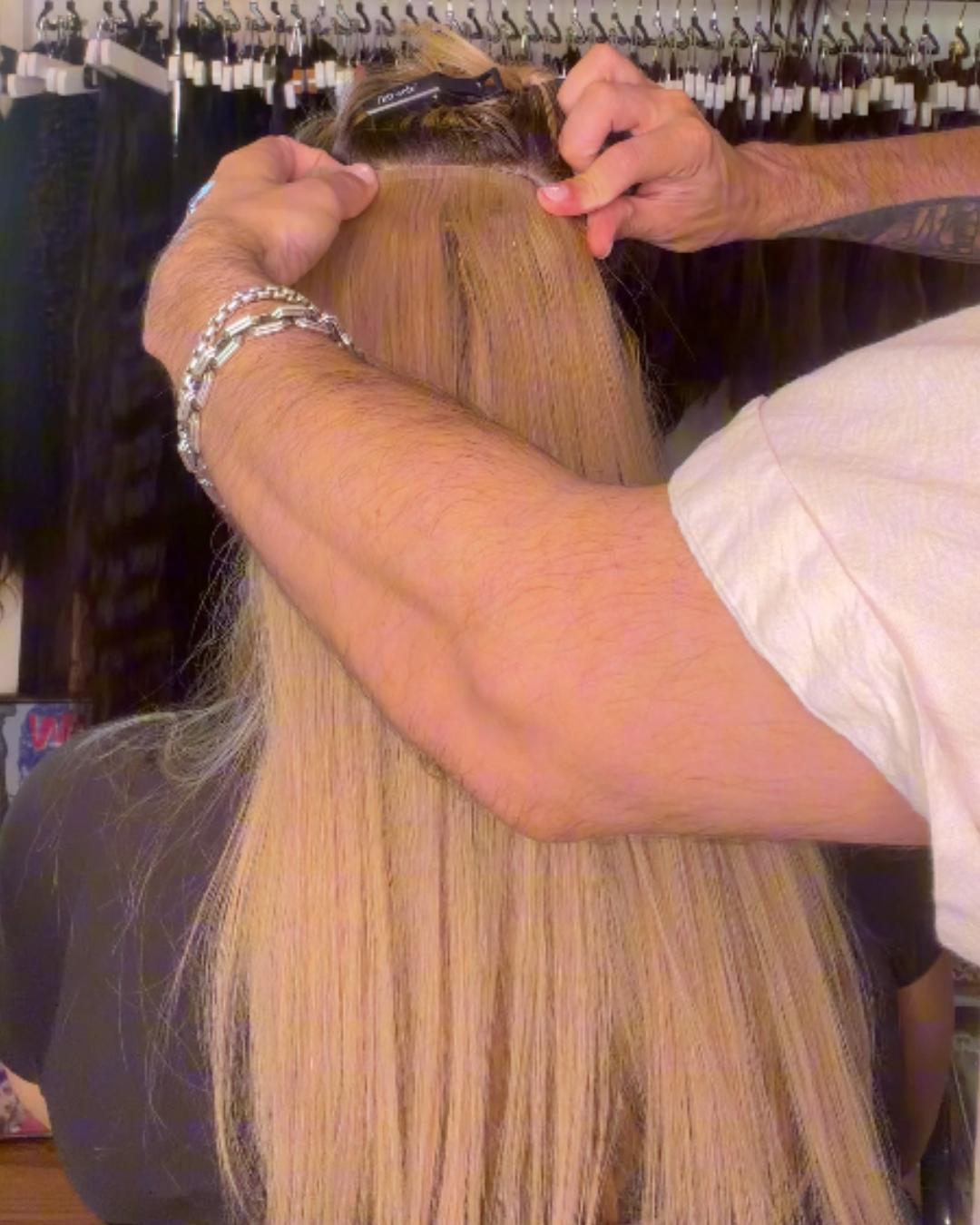 donna bella tape in on a client with blonde hair Photo courtesy of Donna Bella
