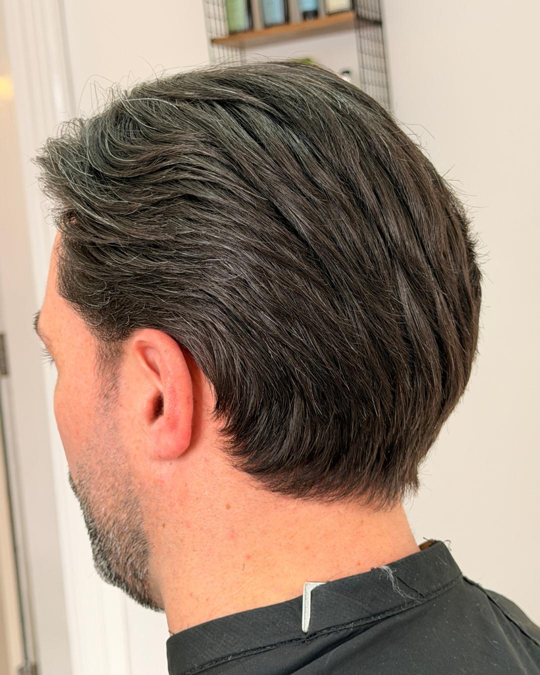 side view of black flow cut with speckles of gray Photo courtesy of Morgan Jones (@morganjonesbarbers)