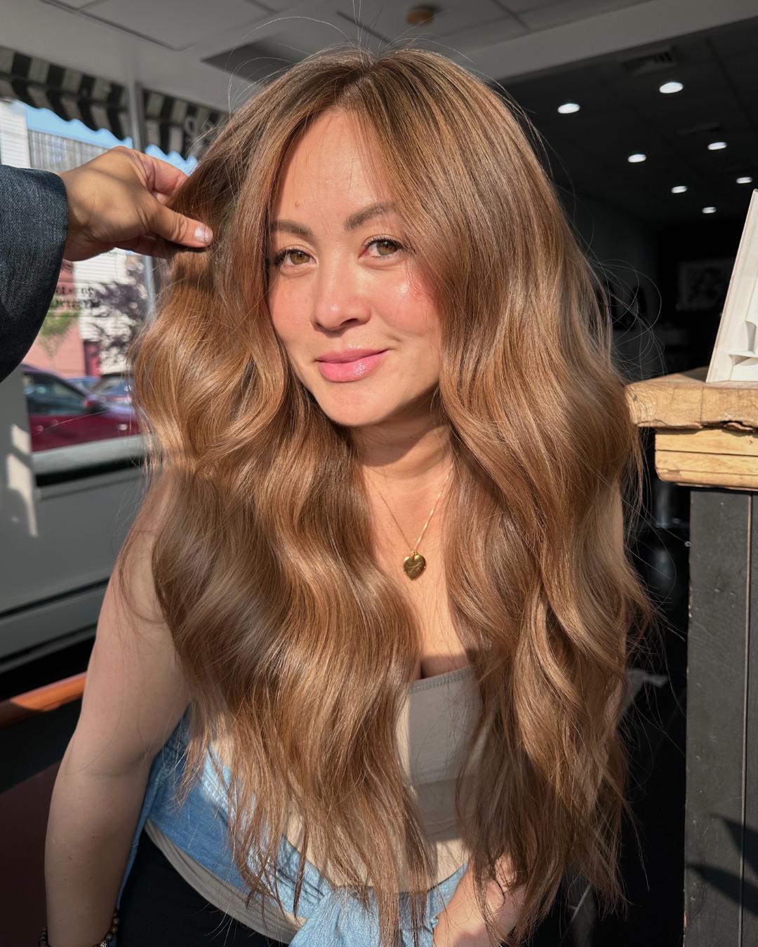 strawberry beige front view with long waves Photo Credit Instagram via @she_is _august