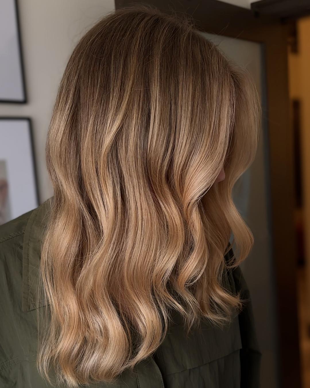 strawberry beige side view with darker roots Photo Credit Instagram via @rob.levi