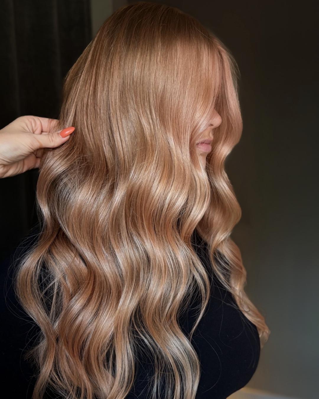 strawberry beige side view with glossy curls Photo Credit Instagram via @mirja.stenbro