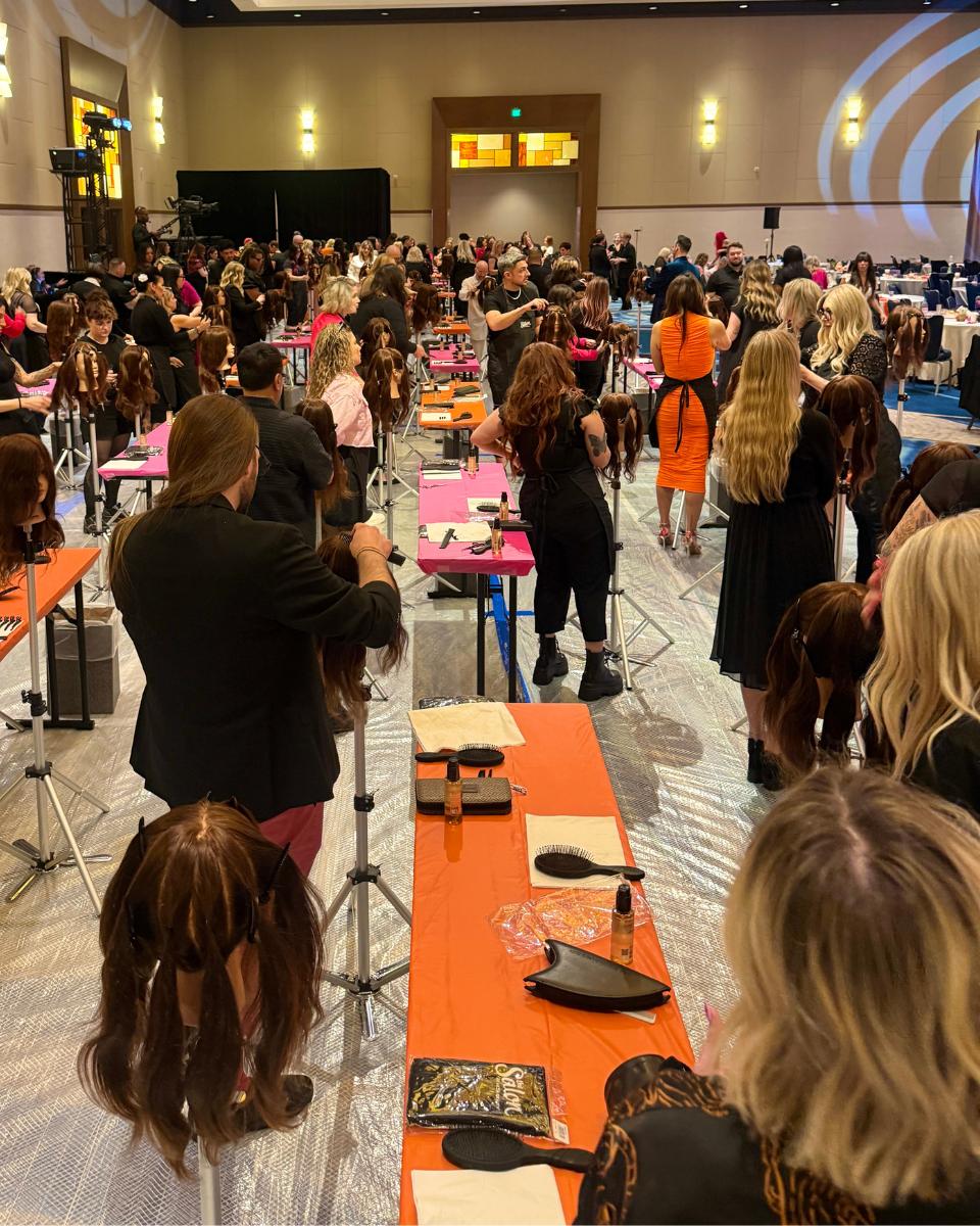 Service District Educators participate in hands-on 2026 trendspiration education with mannequin heads at Ulta Beauty’s Field Leadership Conference.