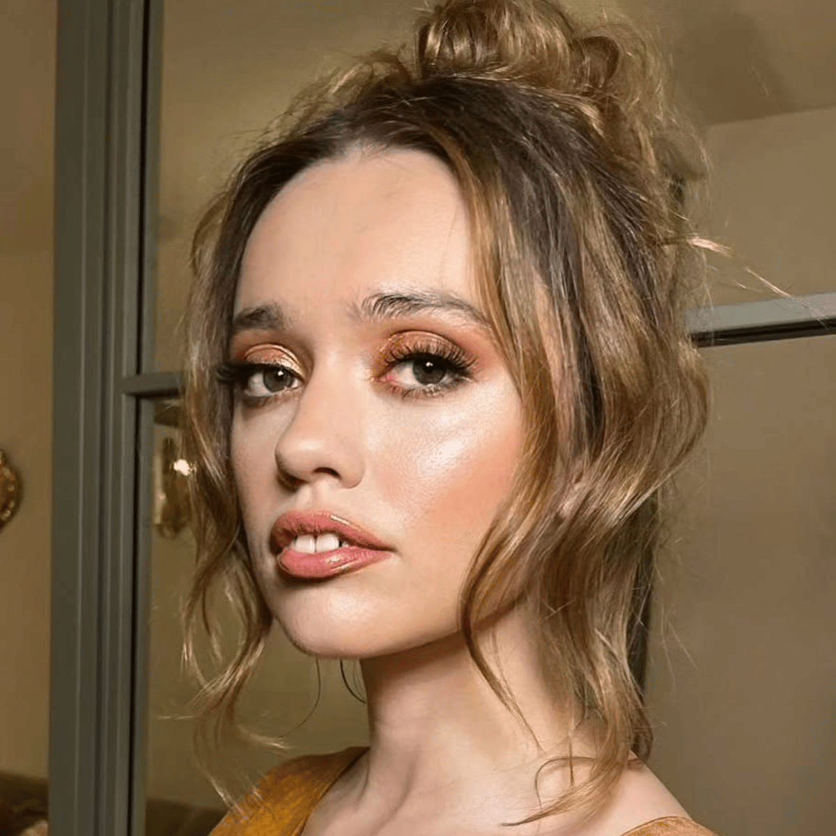Aimee Lou Woods glossy brunette balayage with caramel in an updo