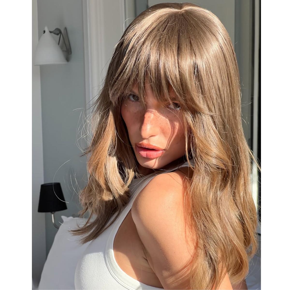 medium length brown butter blonde hair with bangs