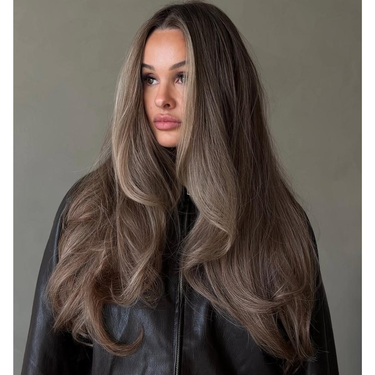 long blowout on brown butter blonde hair Photo Credit Instagram via @taya.hair
