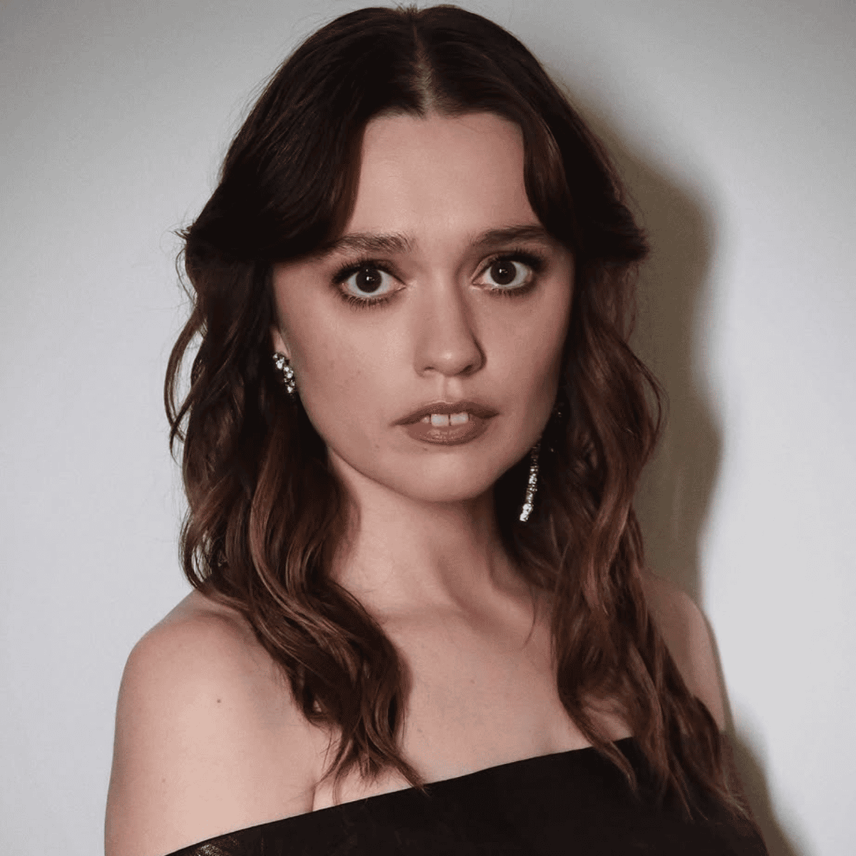 Aimee Lou Wood's glossy brunette transformation with soft, lived-in depth and subtle tonal blends