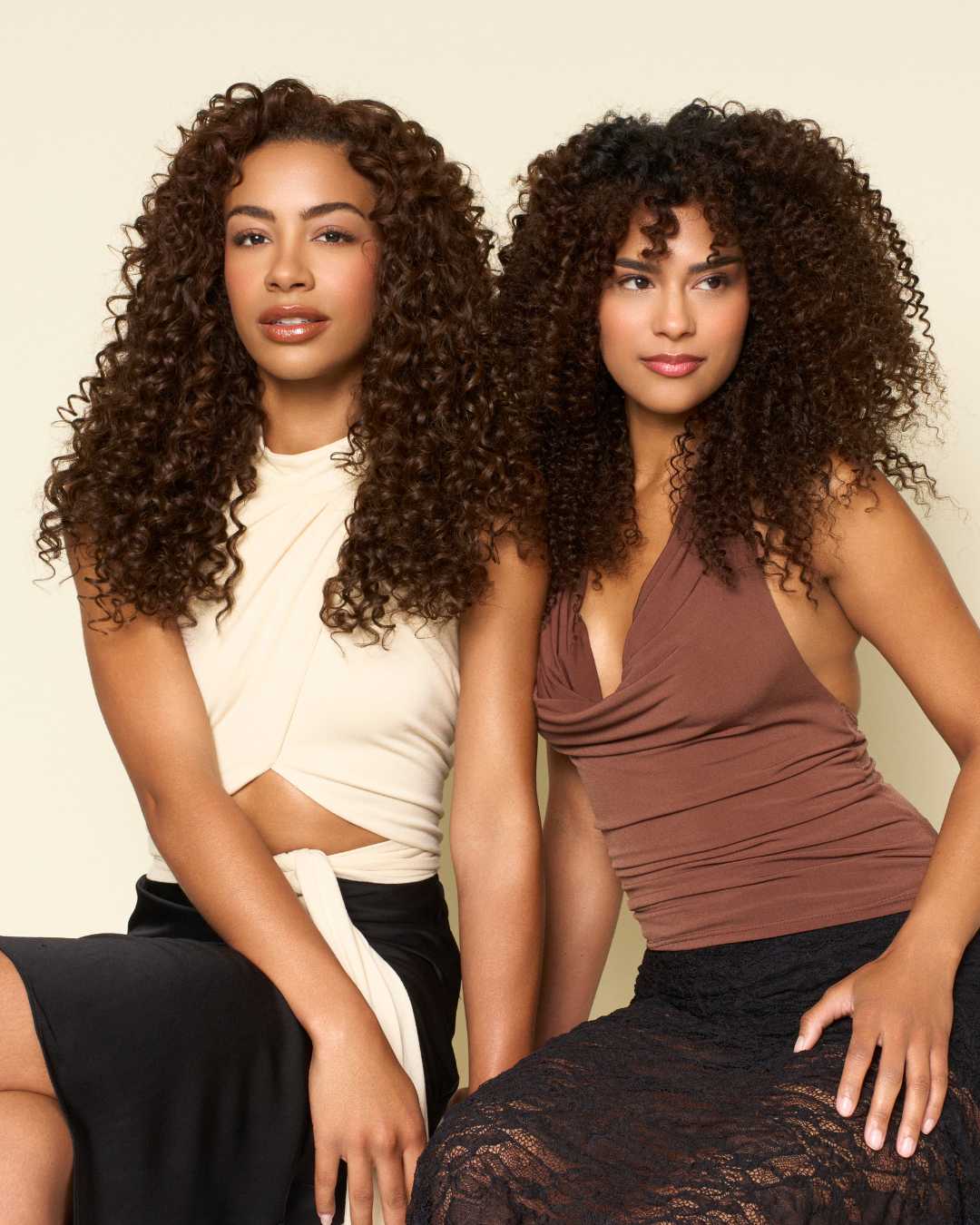 Models wearing The Hair Shop Curly Collection featuring Loose Spiral and Deep Spiral textures