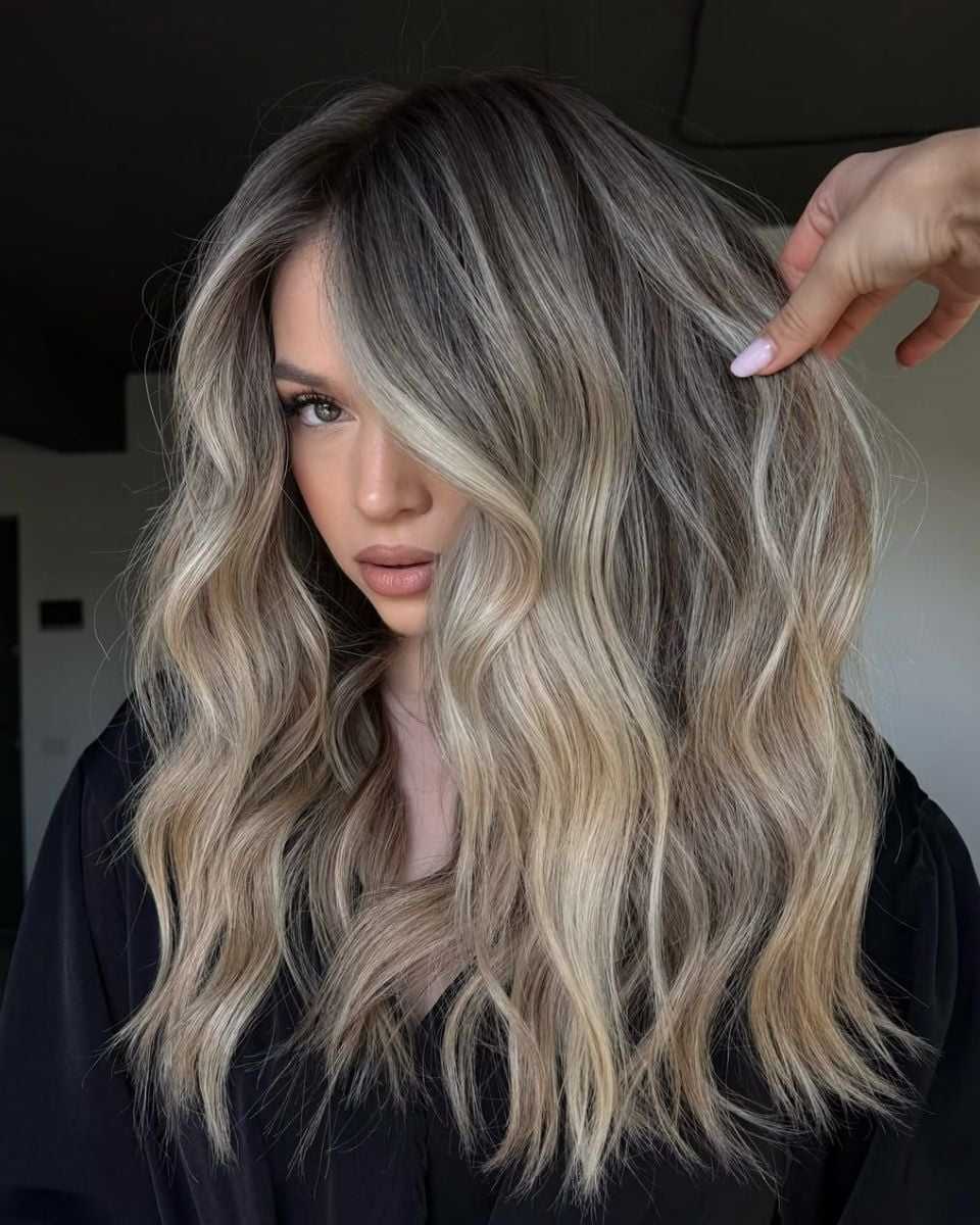 Dimensional ribbon blonde with soft waves, bright face-framing pieces and a seamless root melt.