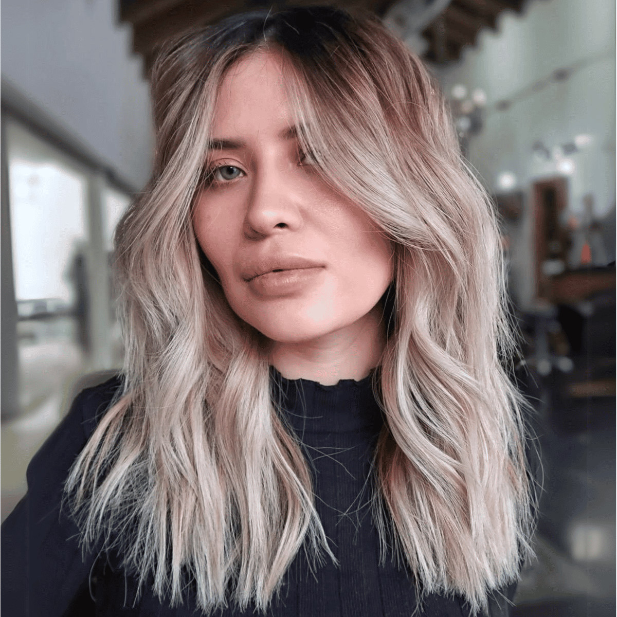 model with blonde ombre hair posing