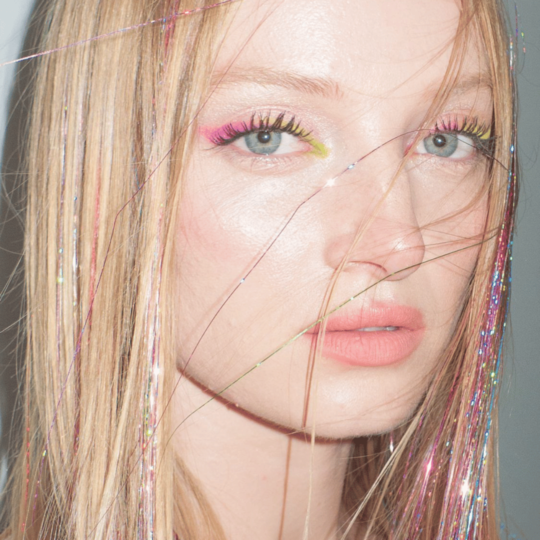 long blonde hair with pink tinsel