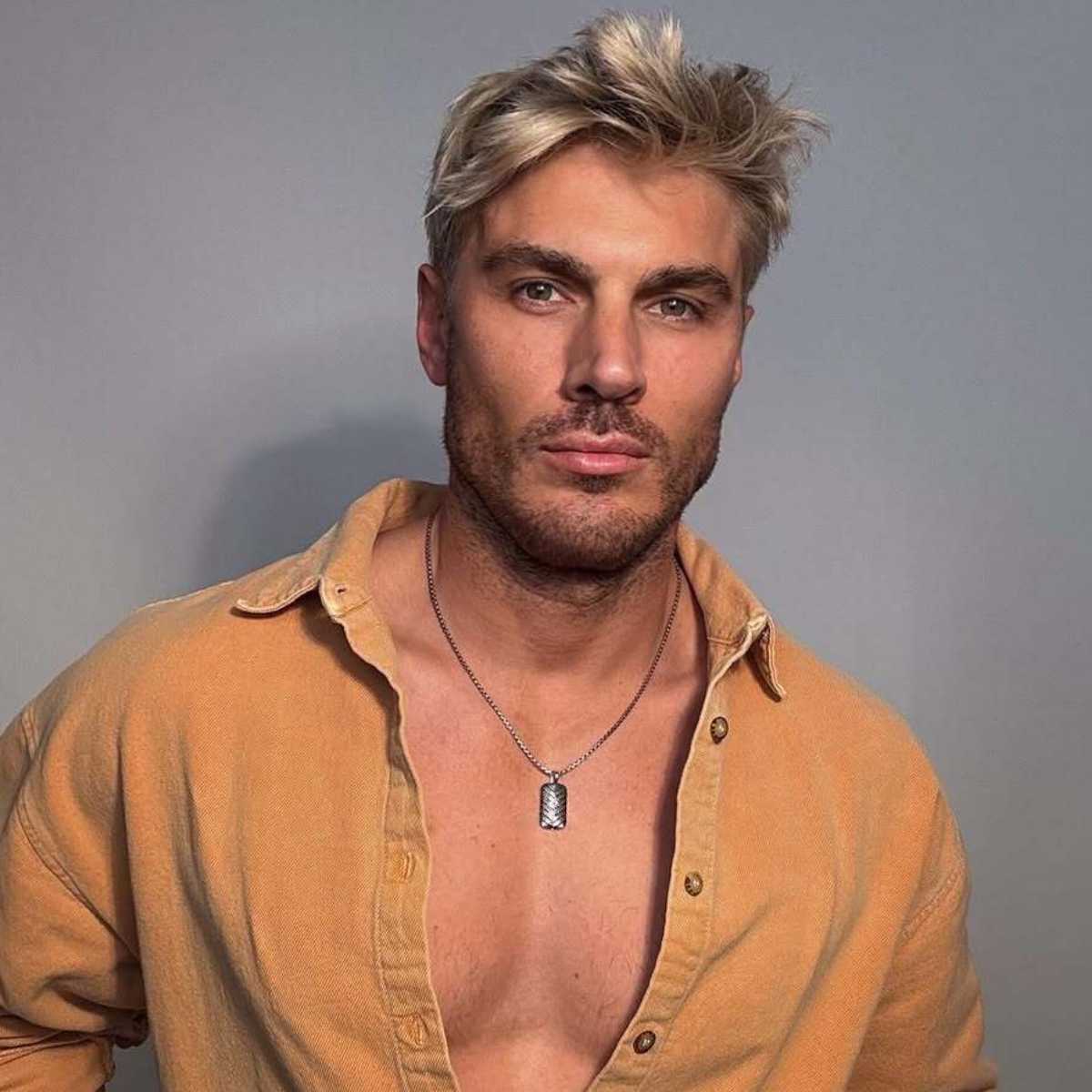 Chris Appleton debuts his new blonde look, styled in a tousled, textured finish.