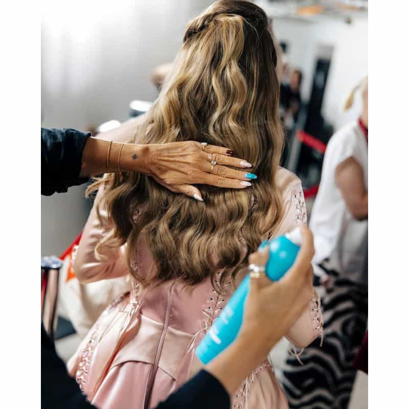 Eurovision 2025 Moroccanoil backstage woman spraying hairspray