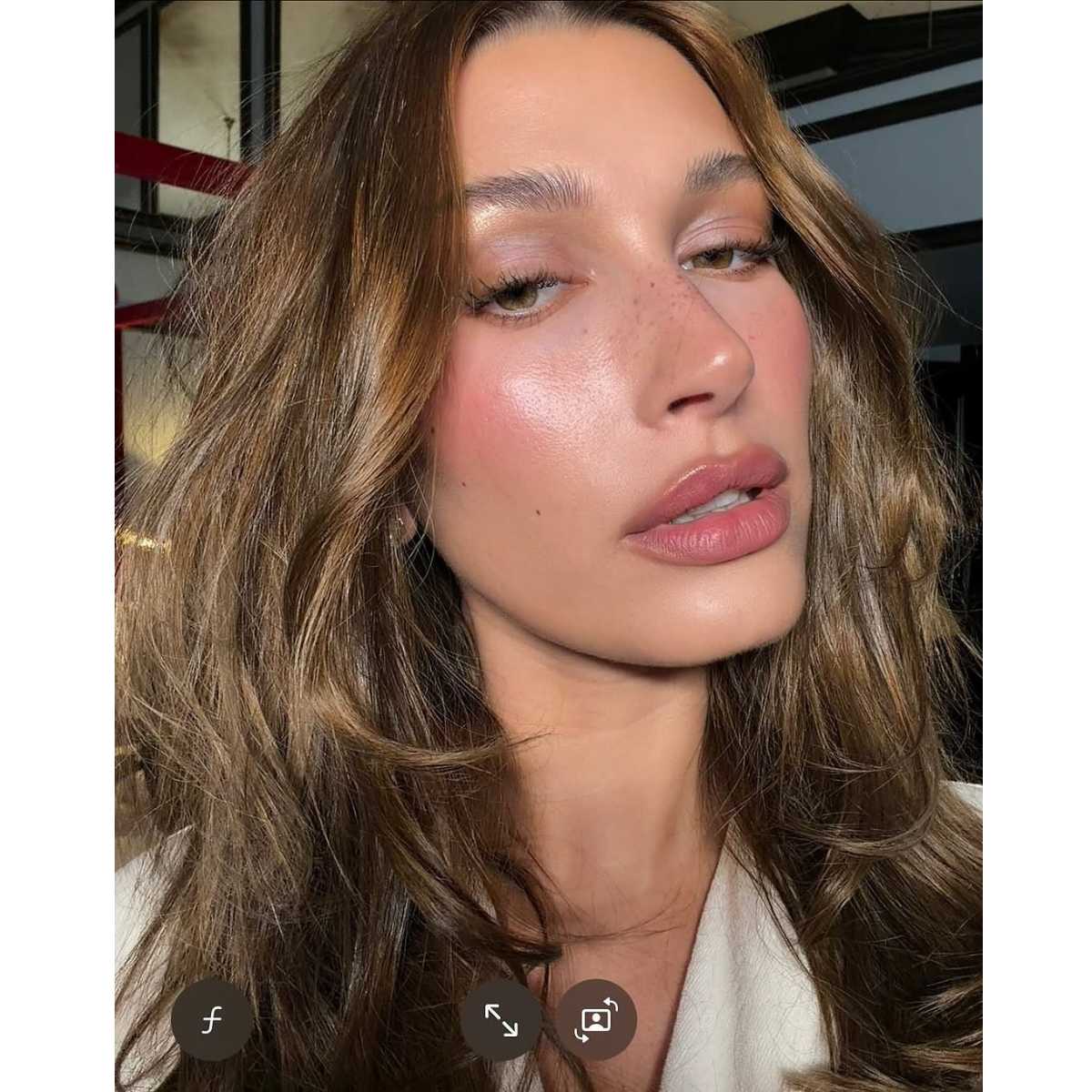 hailey bieber with a glossy lob
