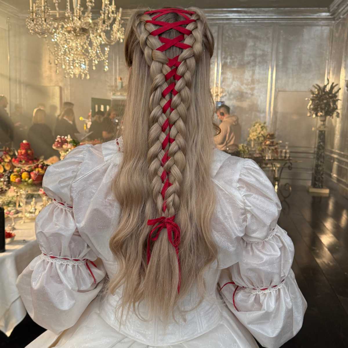 margot robbie with long corset style braid