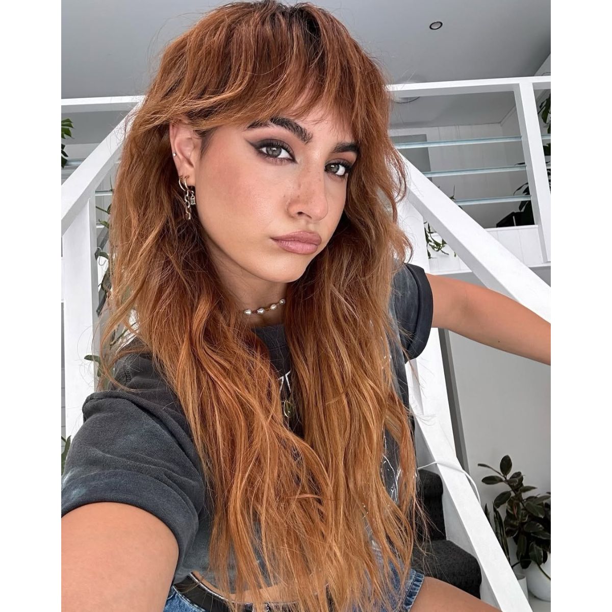 model with a red shag styled