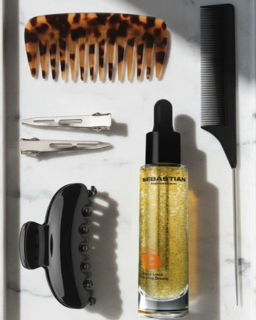 Sebastian Professional Potion 9 Super Luxe Styling Drops displayed with styling accessories.