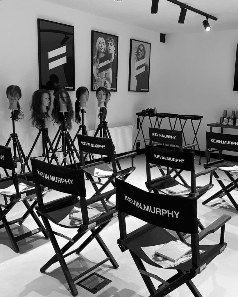 KEVIN.MURPHY Session Salon classroom set up for professional hairstylist education with mannequin heads and styling stations.