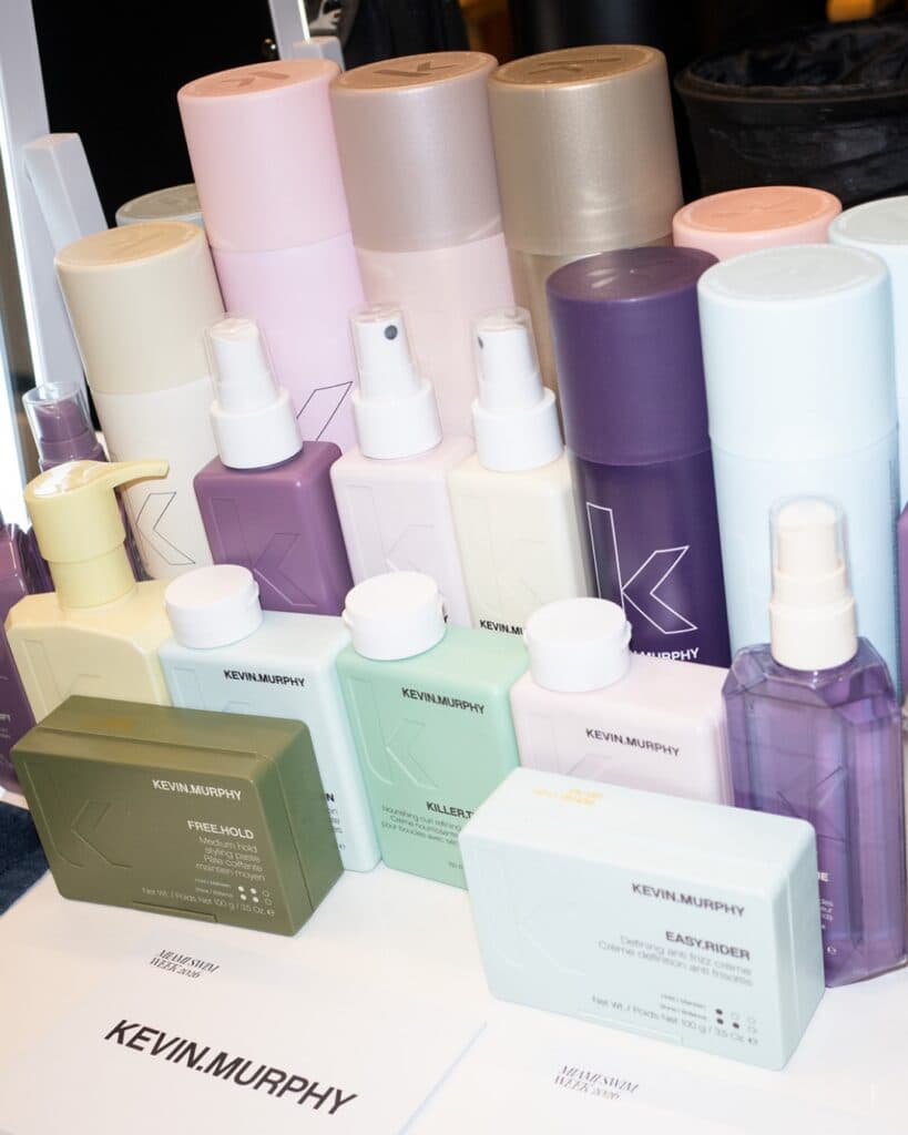 KEVIN.MURPHY professional haircare and styling products displayed during a hairstylist education event.